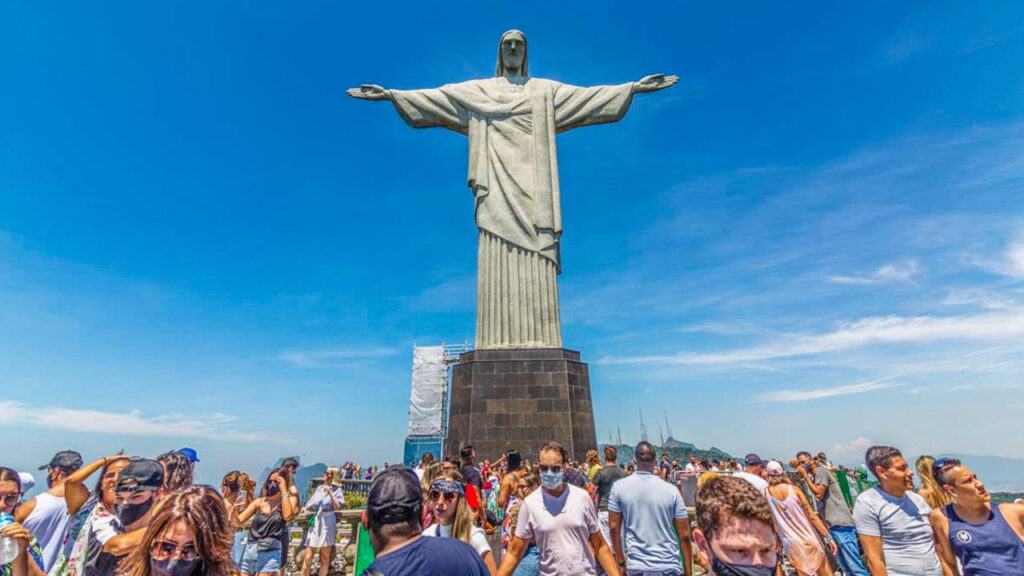Crowd of people below the Christ the Redeemer in Rio